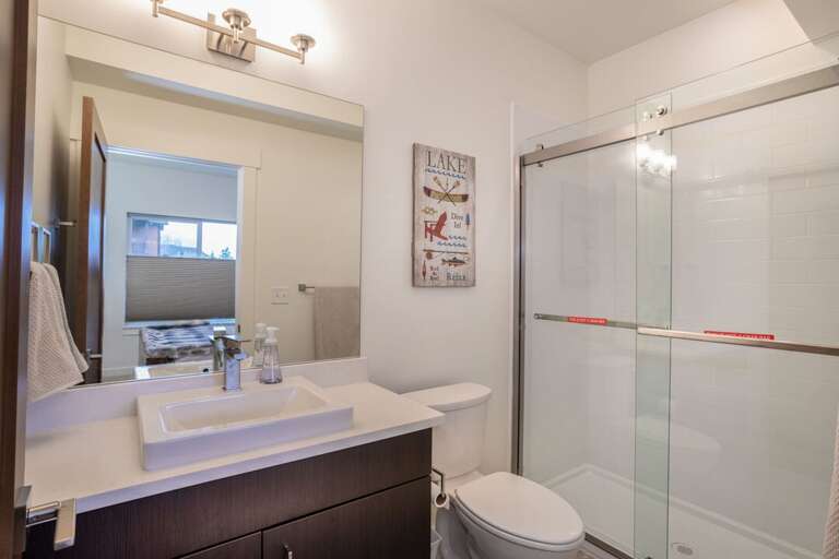 The master ensuite bathroom has an amazing walk-in shower | Lower Level