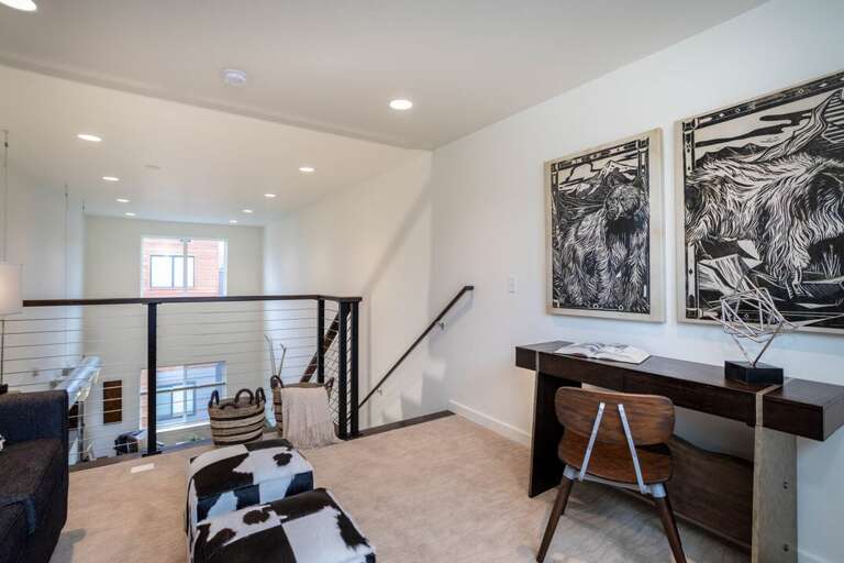 We love the art over the workspace in this home | Upper Level