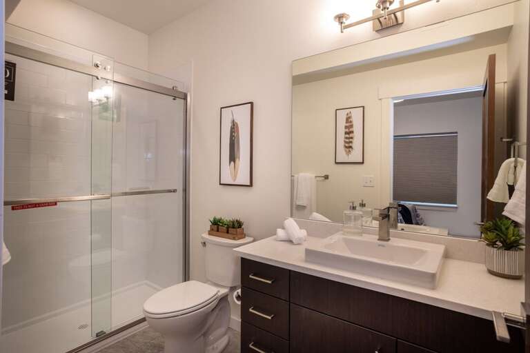The master bathroom has a large walk-in shower, perfect after a long day | Lower Level