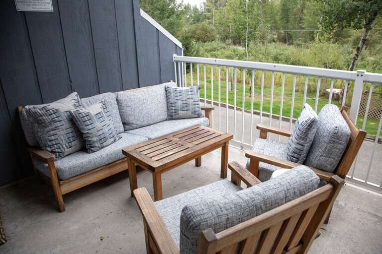 Wooden Furniture With Cushions On Balcony, Backyard View