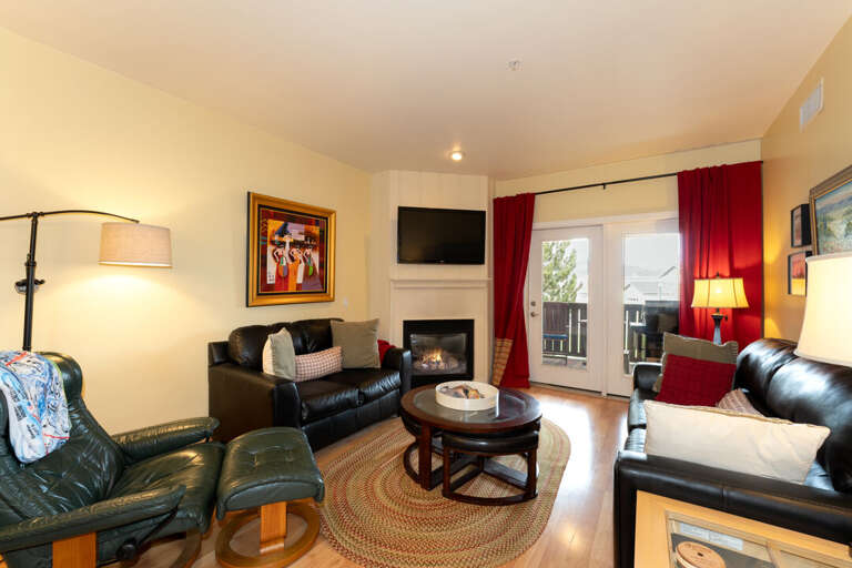 Living Room with Fireplace and Media Feature | Main Level