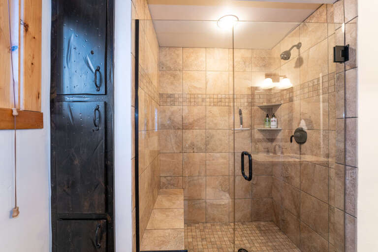 Beautiful Walk-In Shower with Bench in Shared Bathroom | Main Level