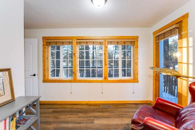 Sitting Area in Bedroom 1 with access to the Exterior | Main Level