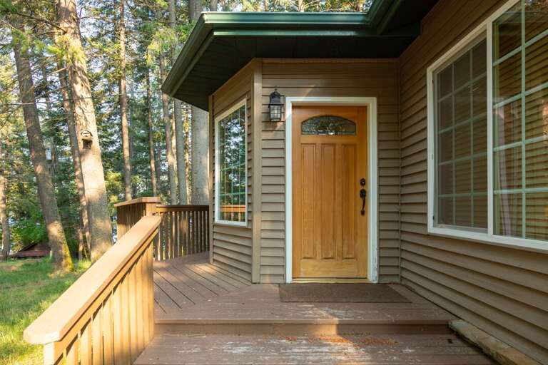 Views of Whitefish Lake through the pines. | Exterior