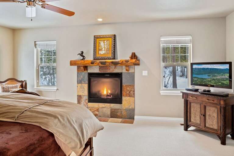 Master Bedroom with a King Bed, TV with Cable, and Gas Fireplace