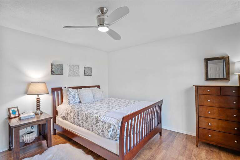 Bedroom 2 with queen bed and dresser