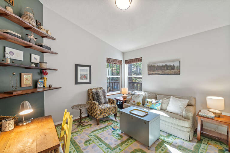 Bedroom 3 / Den with full size sleeper sofa, 32 smart TV, and small desk space