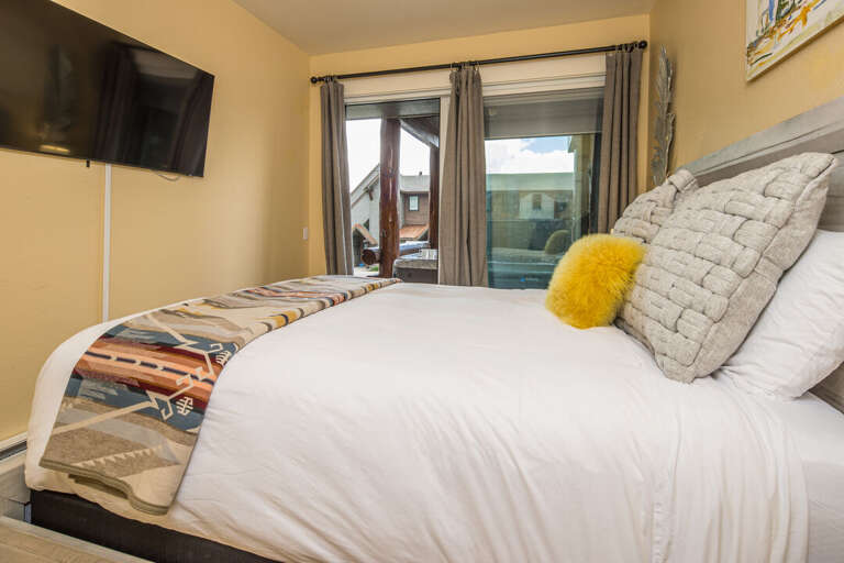 Bedroom with private patio access with hot tub | Lower Level