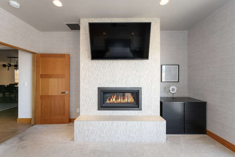 Summit Loft primary with a gas fireplace.