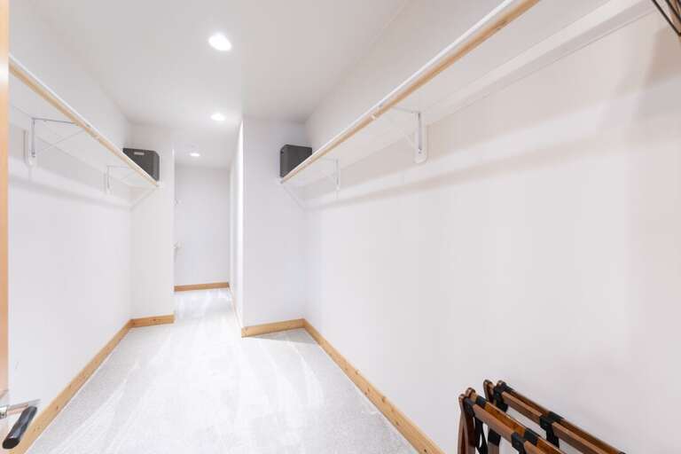 Spacious walk-in closet off the primary ensuite bathroom.