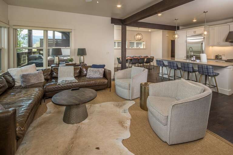 Cozy leather couch with plush chairs for all the be comfortable | main Level