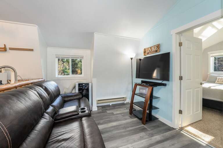 Cozy up to watch TV and wind down after a long day | Upper Level