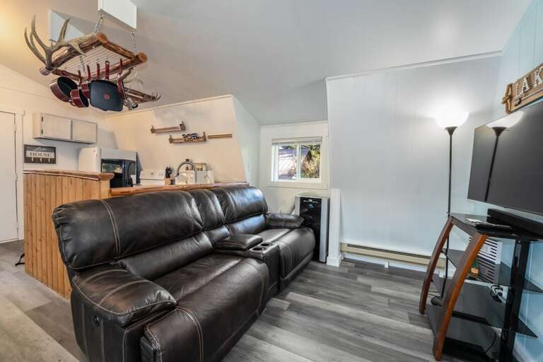 Plush leather couch, snuggle up with a glass of wine, or a cup of coffee | Upper Level