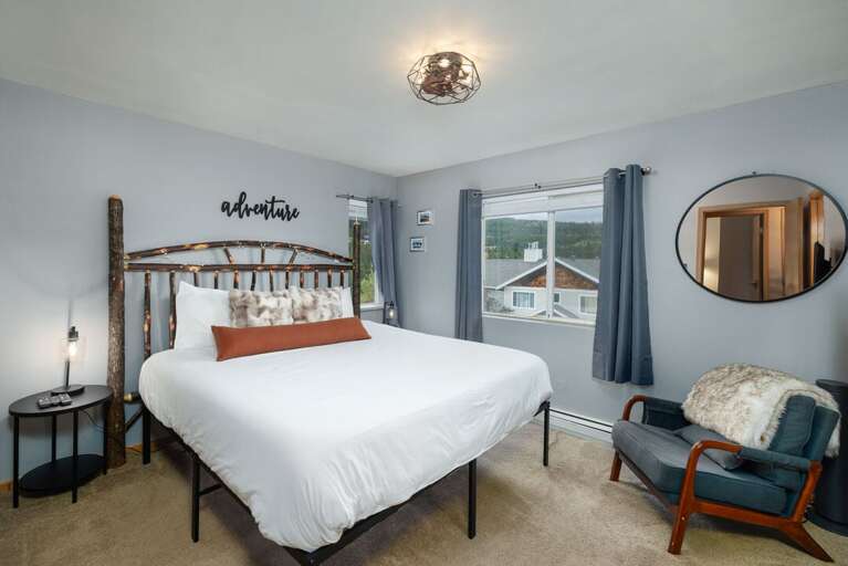 Cozy up in the primary bedroom on a King bed | Main Level Cozy up in the primary bedroom on a King bed | Main Level