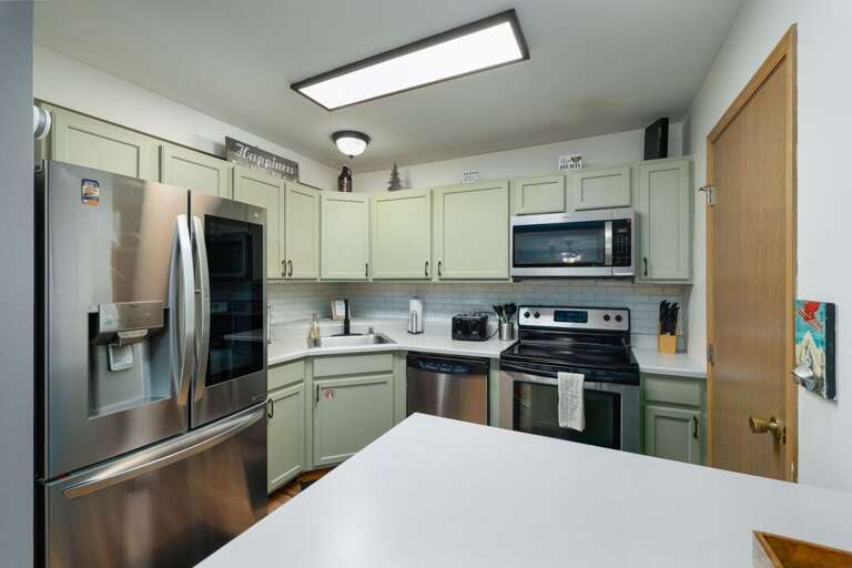 Enjoy a home-cooked meal in this fully equipped kitchen | Main Level Enjoy a home-cooked meal in this fully equipped kitchen | Main Level