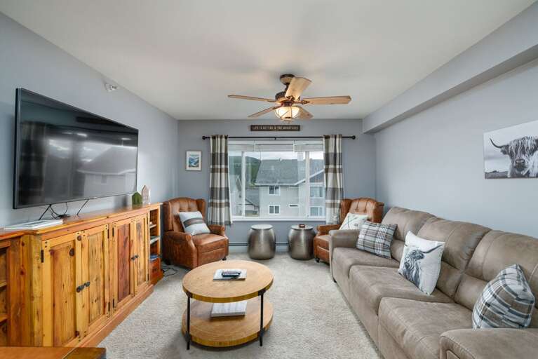 Queen sleeper sofa makes an easy place to nestle in and recharge for the next day | Main Level