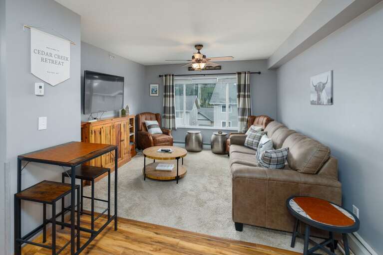 Wind down in this toasty, soothing living room after a day on the slopes | Main Level Wind down in this toasty, soothing living room after a day on the slopes | Main Level