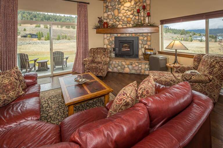 Cozy up in front of the fireplace to warm up after building a snowman | Main Level