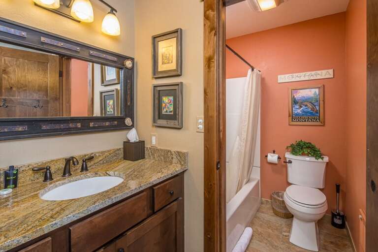 Single vanity bathroom with Tub/shower combo | Upper Level