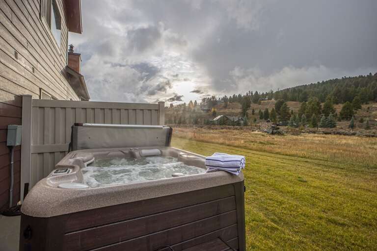 Soak in the relaxing hot tub under the stars after a long day in the mountains | Exterior Soak in the relaxing hot tub under the stars after a long day in the mountains | Exterior
