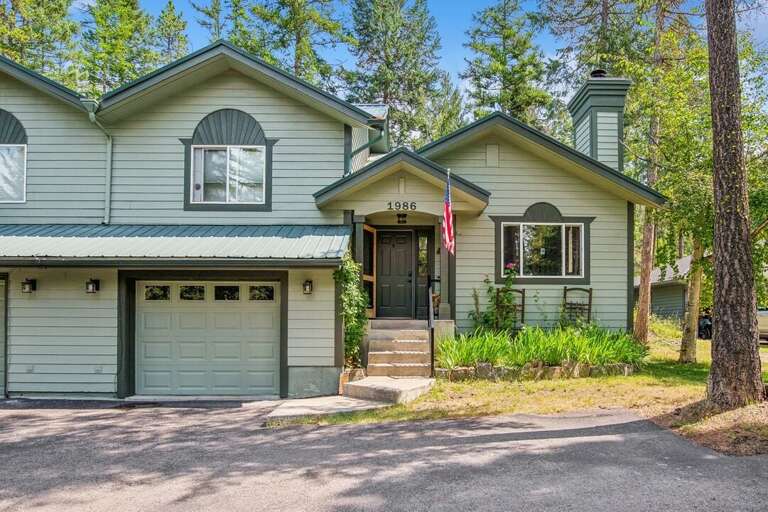 Charming home with a neatly landscaped front yard. | Exterior