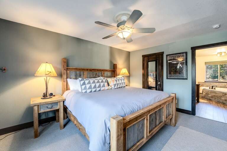 Primary bedroom with a walk-in closet and an ensuite bathroom. | Upper Level