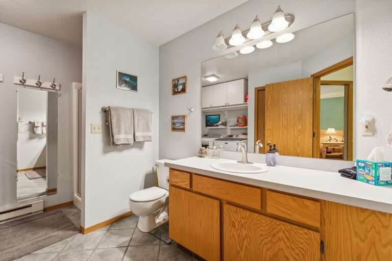 Shared bathroom with a large vanity. | Lower Level