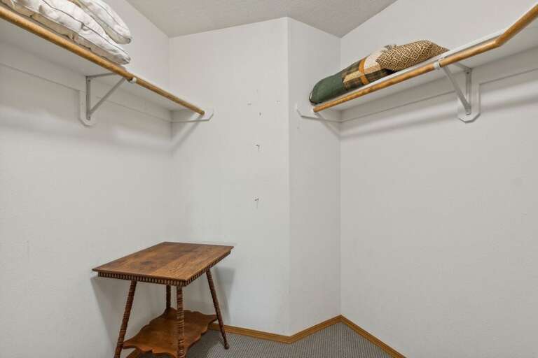 A walk-in closet for plenty of space to hang your Western outfits! | Upper Level