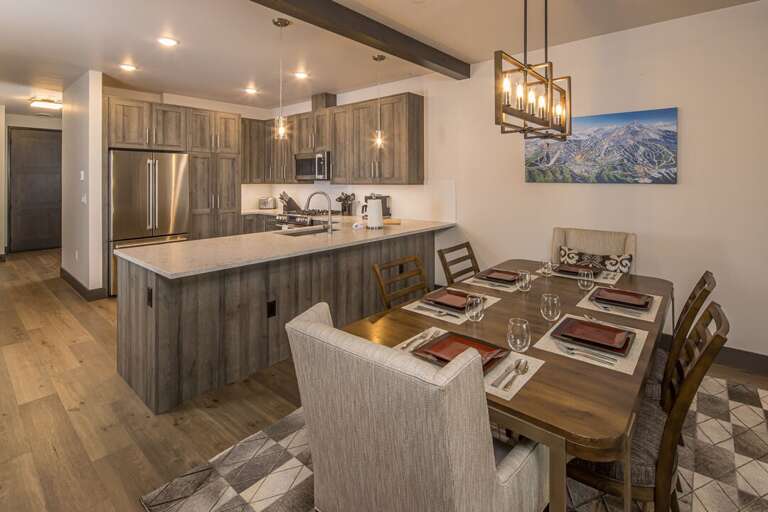 Dining table with seating for 6, two additional chairs for larger parties. | Main Level