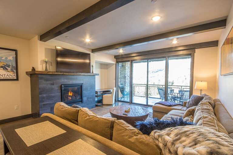 Warm up on the couch with the lovely gas fireplace. | Main Level