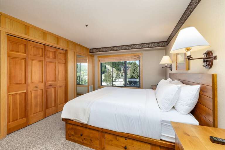 Snuggle into this king size bed after a long day of adventuring Big Sky Resort | Main Level