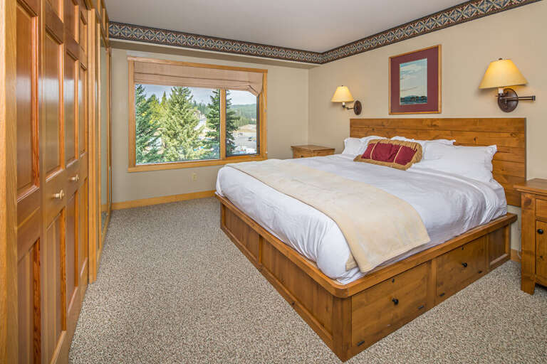 Snuggle into this king size bed after a long day of adventuring Big Sky Resort | Main Level