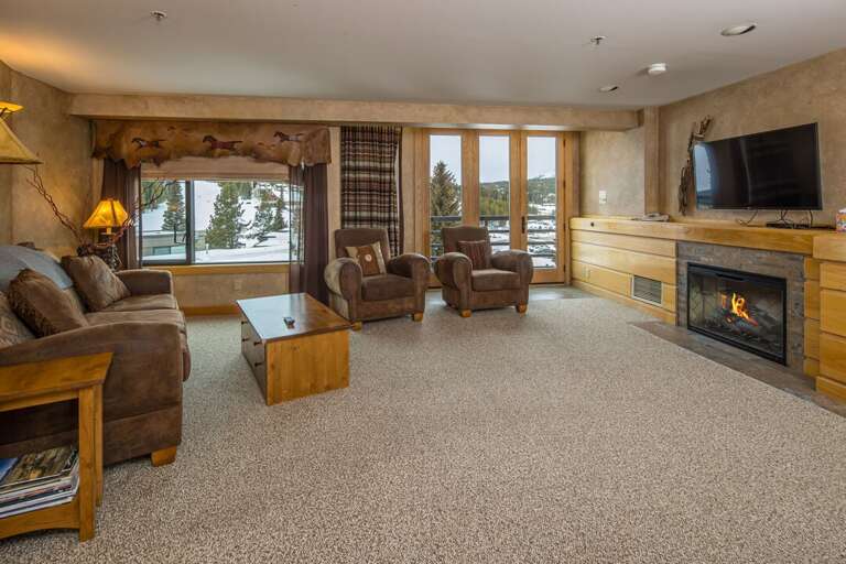 Watch a movie in front of the fireplace and relax after a long day on the slopes | Main Level