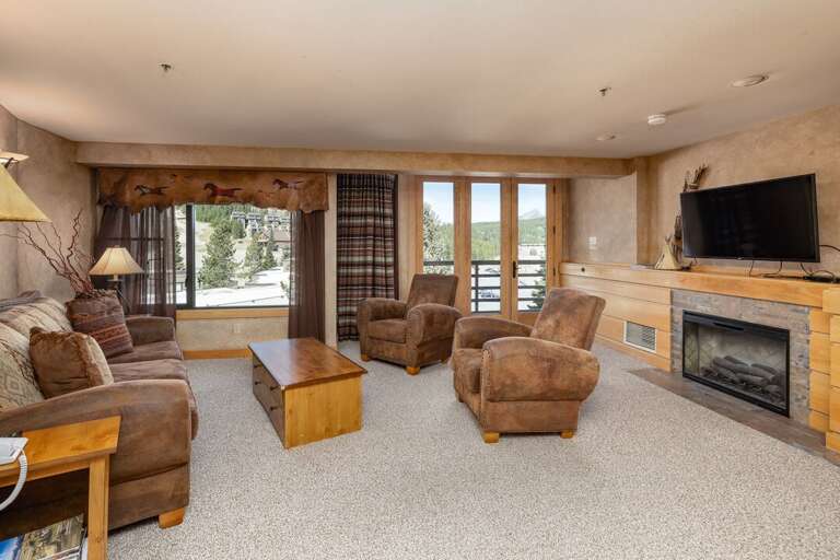 Watch a movie in front of the fireplace and relax after a long day on the slopes | Main Level