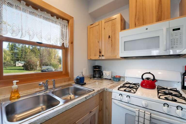 A charming window view- perfect for brewing your morning coffee. | Main Level | Northern Lights