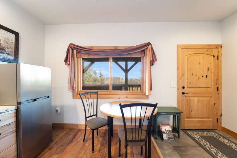 Enjoy breakfast and the dining table that overlooks the surrounding areas. | Upper Level | Aerie