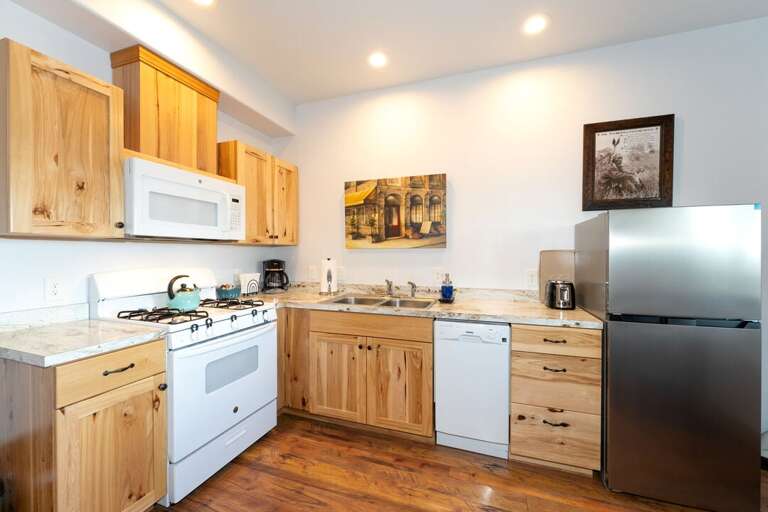 A fully stocked kitchen with a gas range makes it easy to cook any dish! | Upper Level | Aerie
