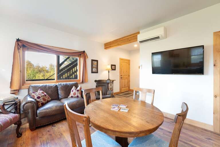 Gather around the dining table to play a round of cards after a day exploring. | Main Level | Southern Cross