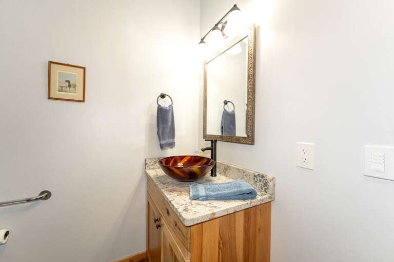 Single vanity sink with storage underneath for everyone in the group. | Main Level | Northern Lights