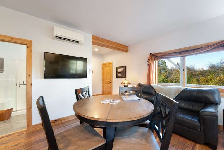 Dining and kitchen room featuring a TV. | Main Level