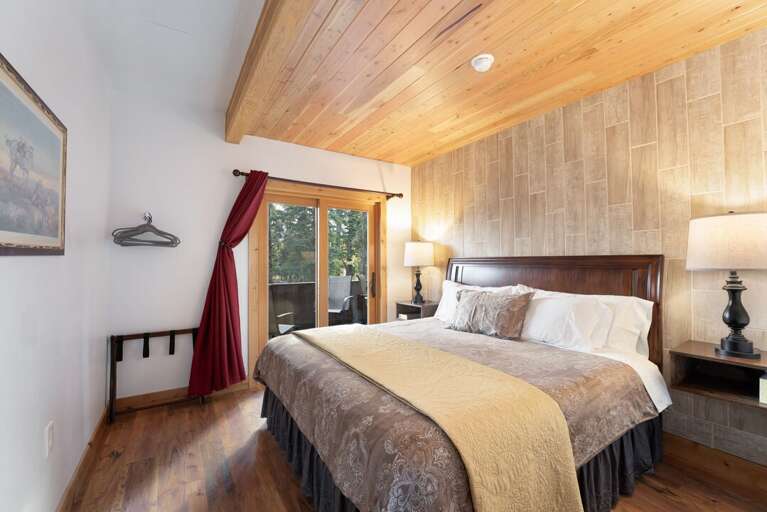 Primary bedroom with private deck. | Main Level
