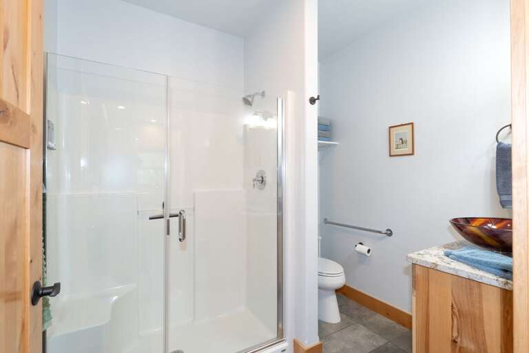 Stand-up shower in the shared bathroom. | Main Level
