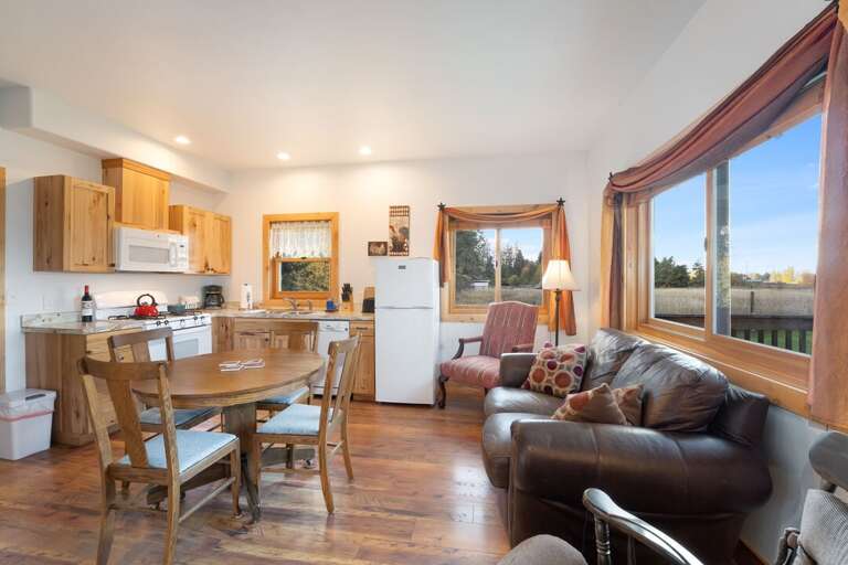 Ample natural lighting and gorgeous views from the large windows in the Southern Cross cabin. | Main Level