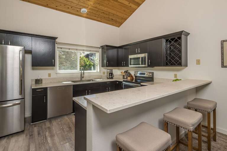 Black-and-beige Kitchen In A Sleek Vacation Rental