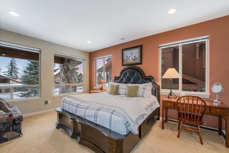 First bedroom featuring a king size bed.