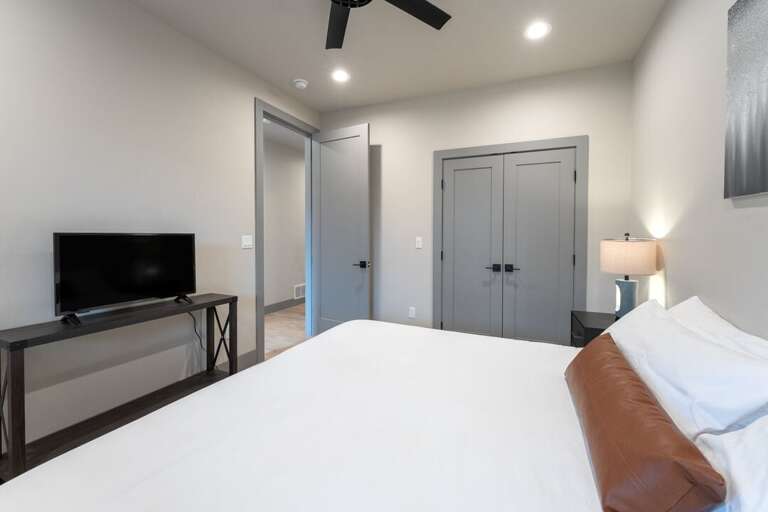 TV and closet. | Upper Level