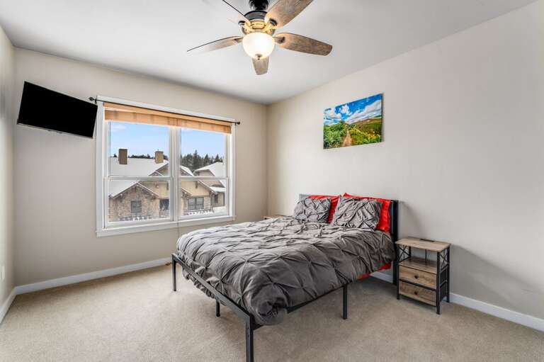Second bedroom with mounted TV. | Upper Level