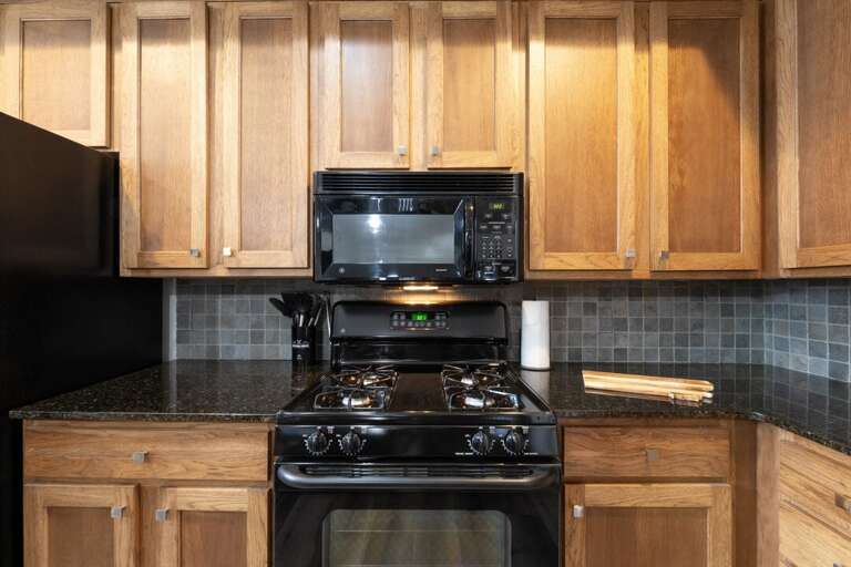 Gas range stove and microwave. | Main Level
