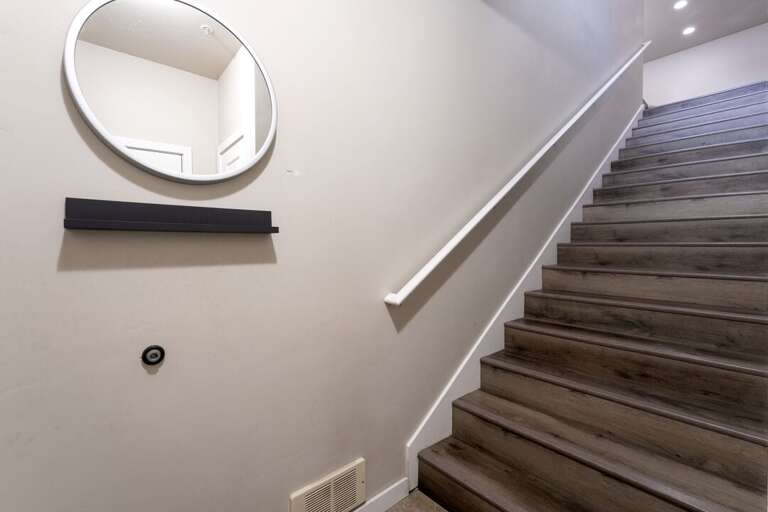 Staircase to main level. | Lower Level