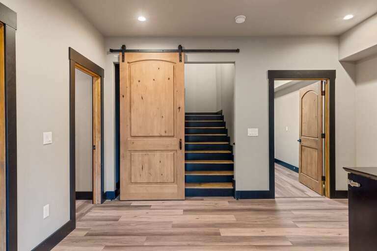 Ascend down the stairs to find a complete second living space | Lower Level